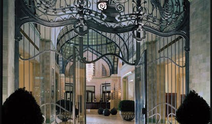 Four Seasons Gresham Palace Hungary atrium wrought iron gate glass roof chandelier