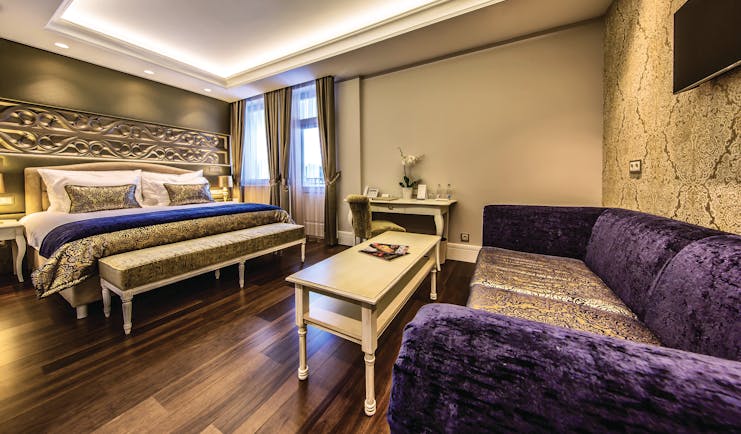 Prestige Hotel Budapest deluxe executive bedroom carved head board sofa coffee table desk and chairs