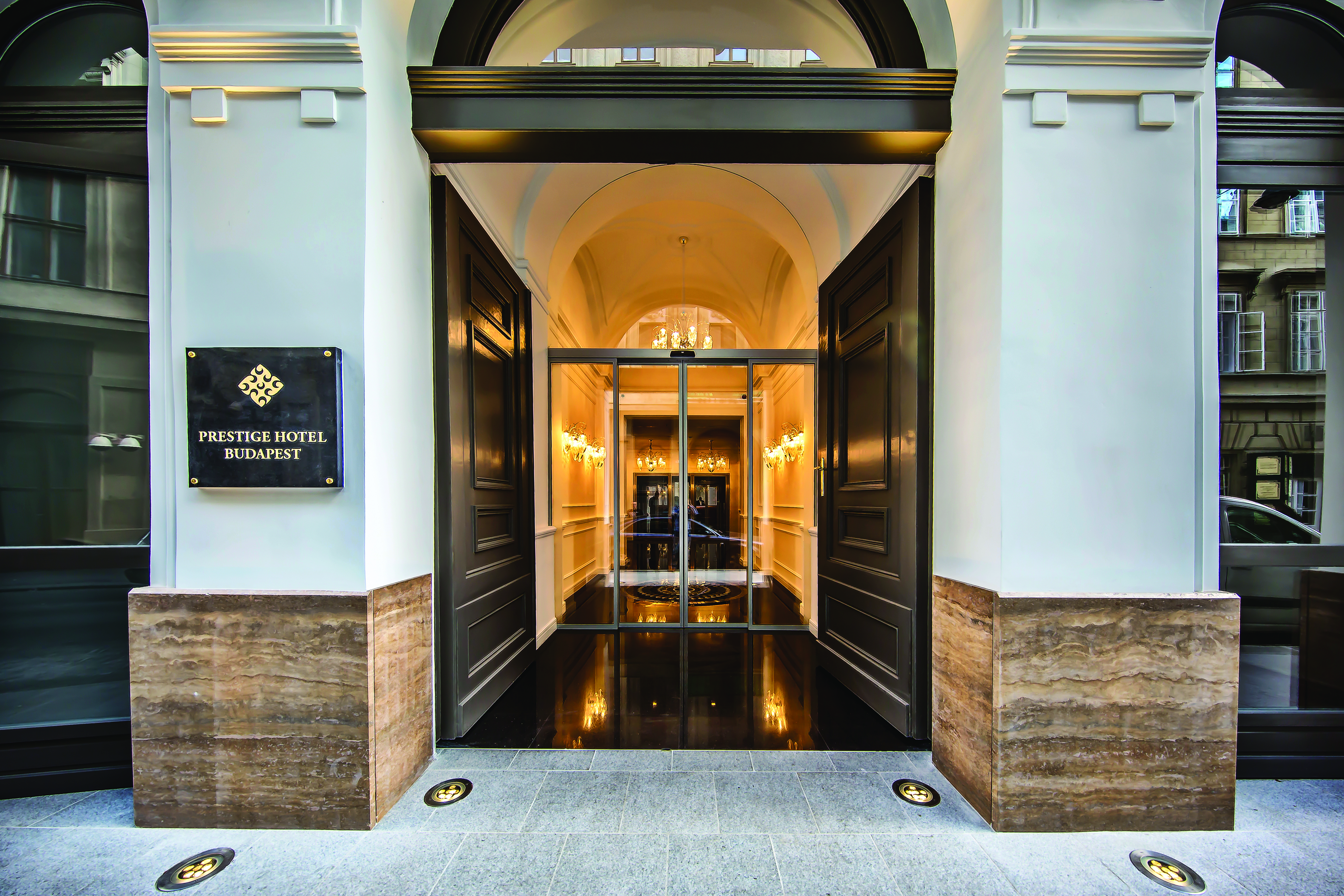 Prestige Hotel Budapest entrance to a hotel with a sign reading 'Prestige Hotel Budapest'