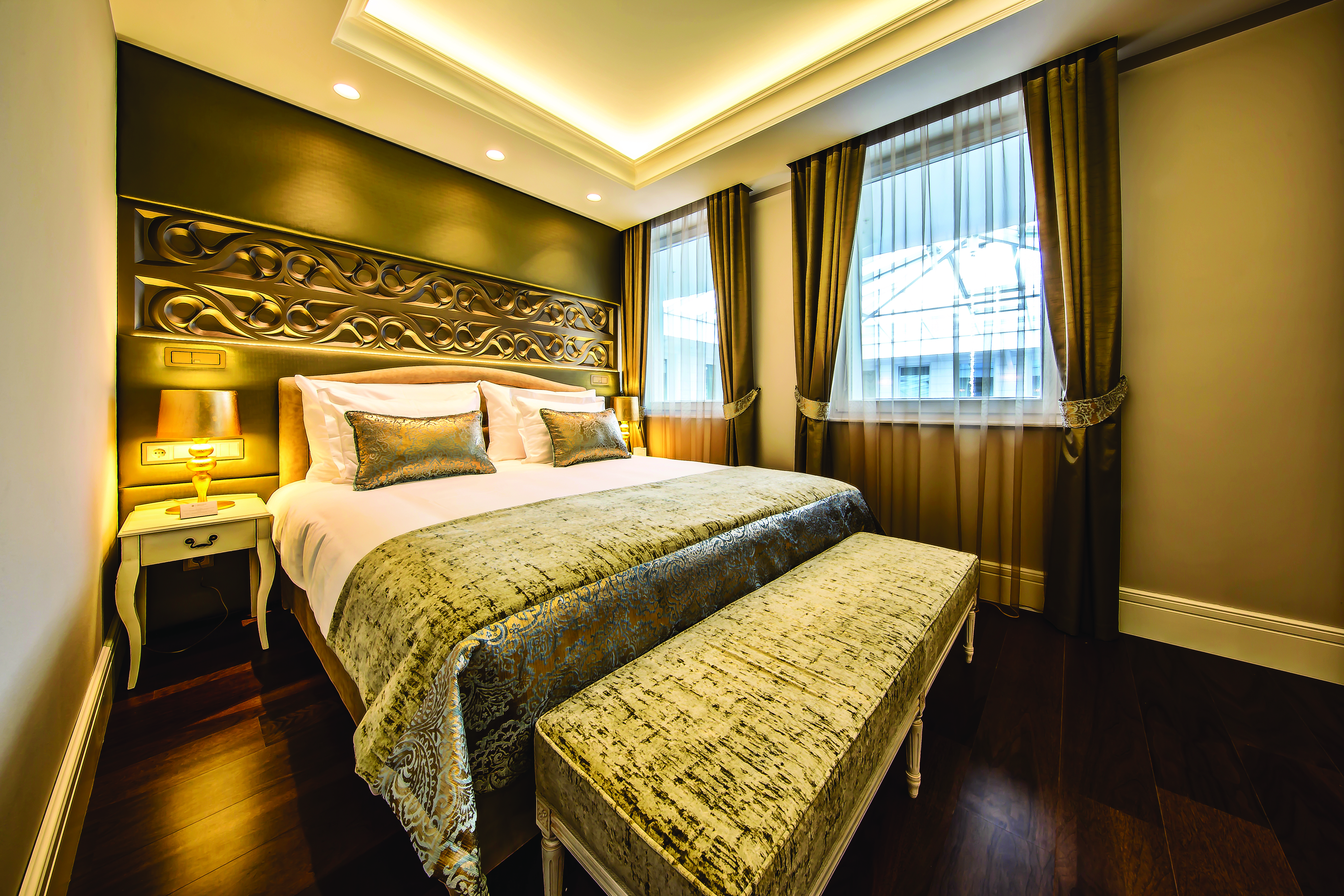 Prestige Hotel Budapest superior standard bedroom ottoman carved head board and bedside table