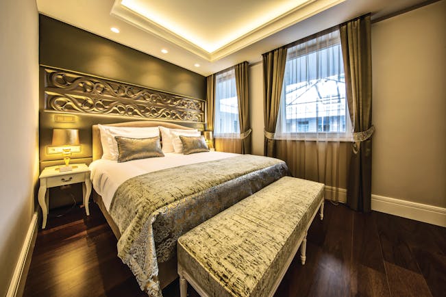 Prestige Hotel Budapest superior standard bedroom ottoman carved head board and bedside table