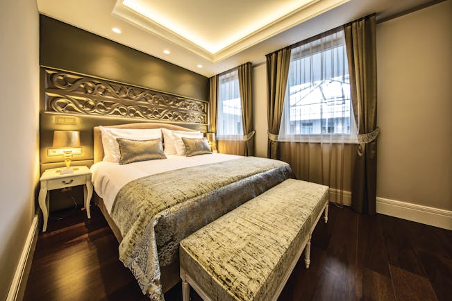 Prestige Hotel Budapest superior standard bedroom ottoman carved head board and bedside table