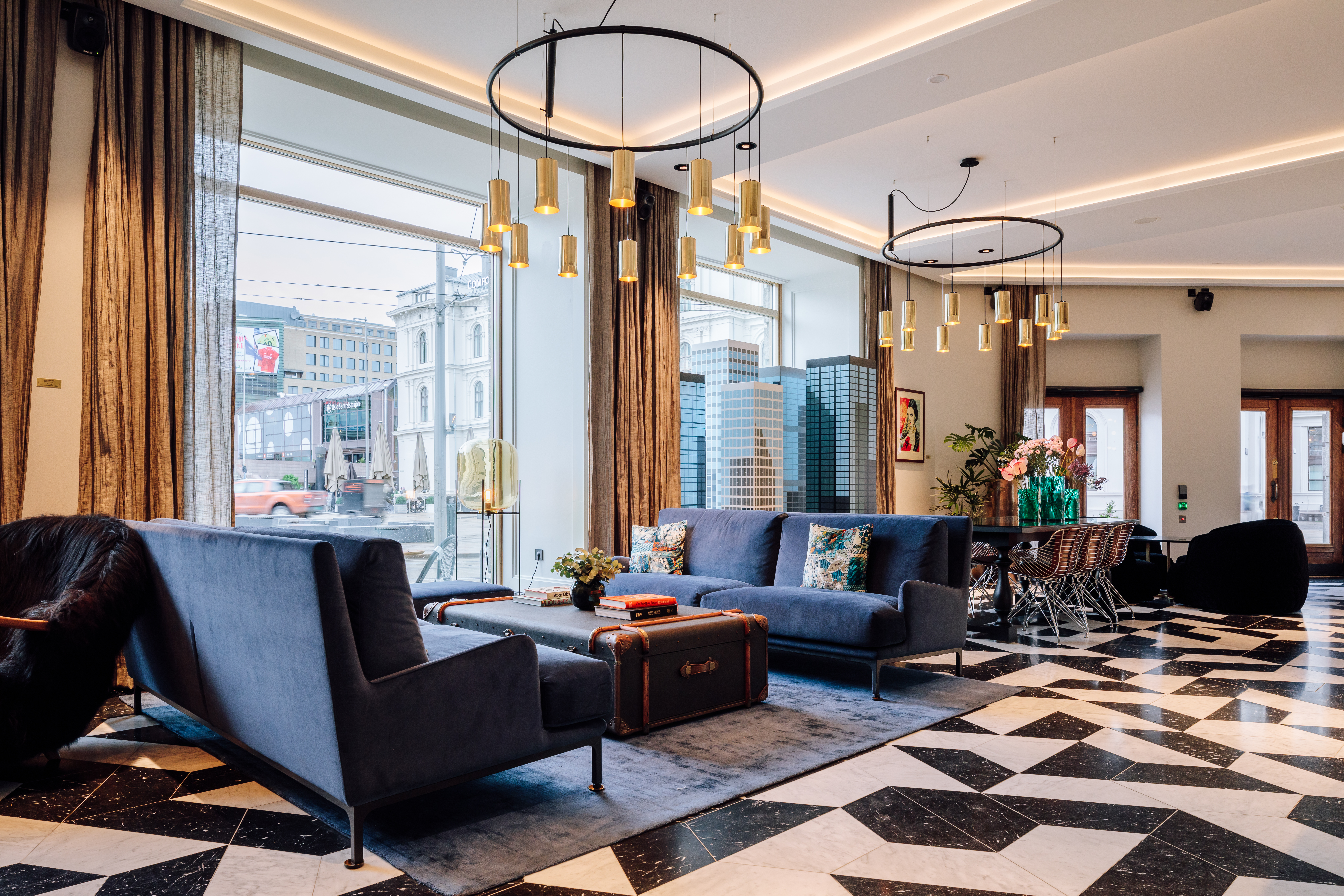 Amerikalinjen hotel black and white floor with blue chairs of hotel lobby