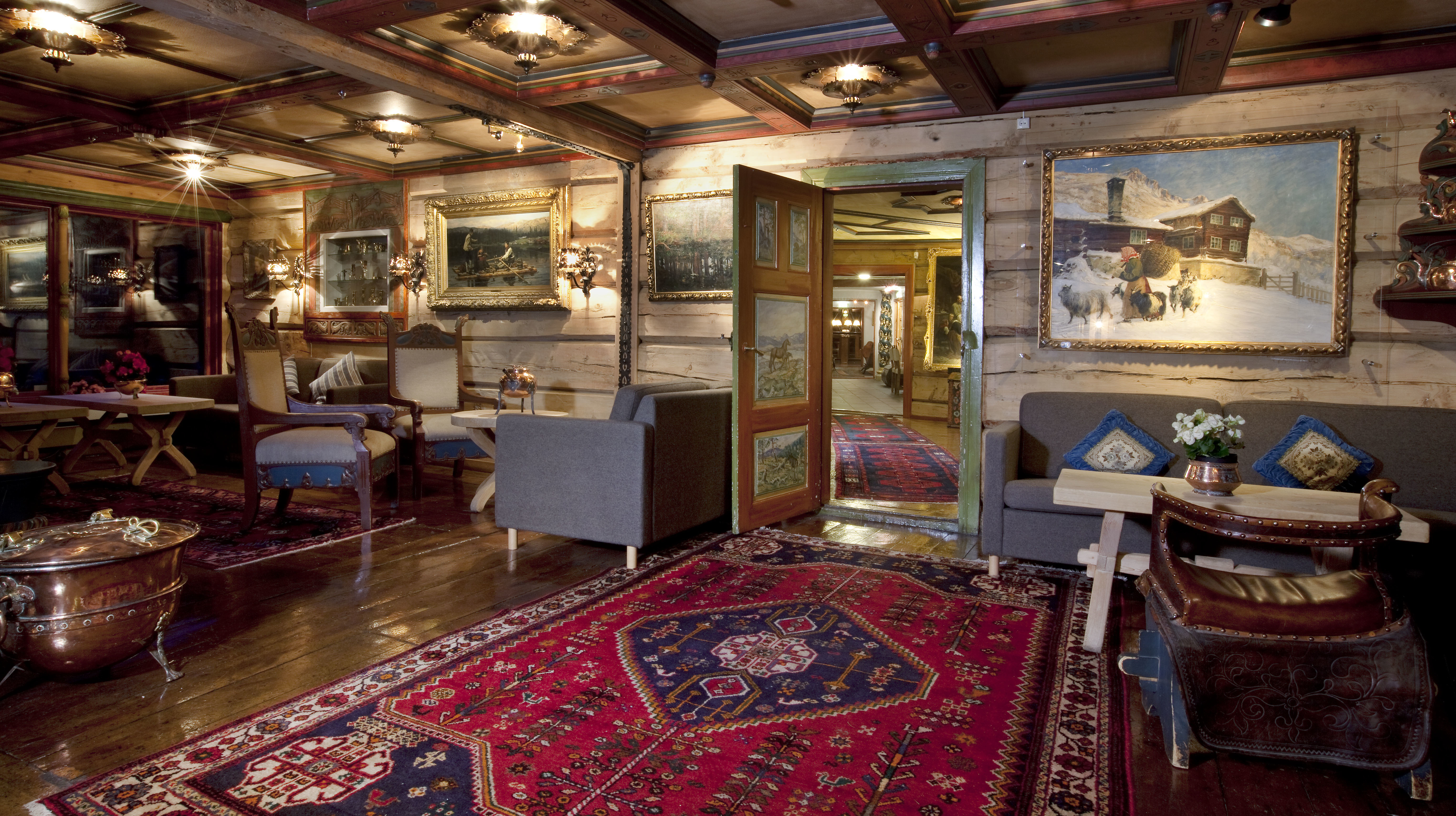 Cosily furnished lounge open fire and rugs at the Elveseter Hotel