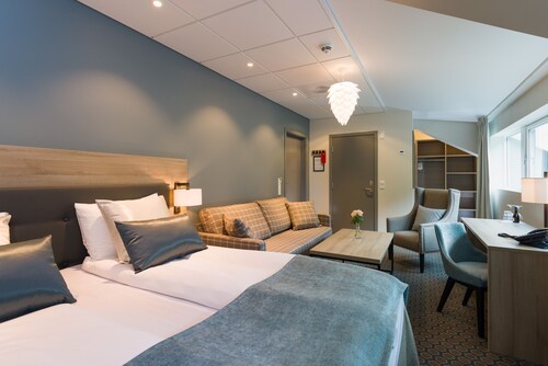 Fru Haugans Hotel Family room with sitting area