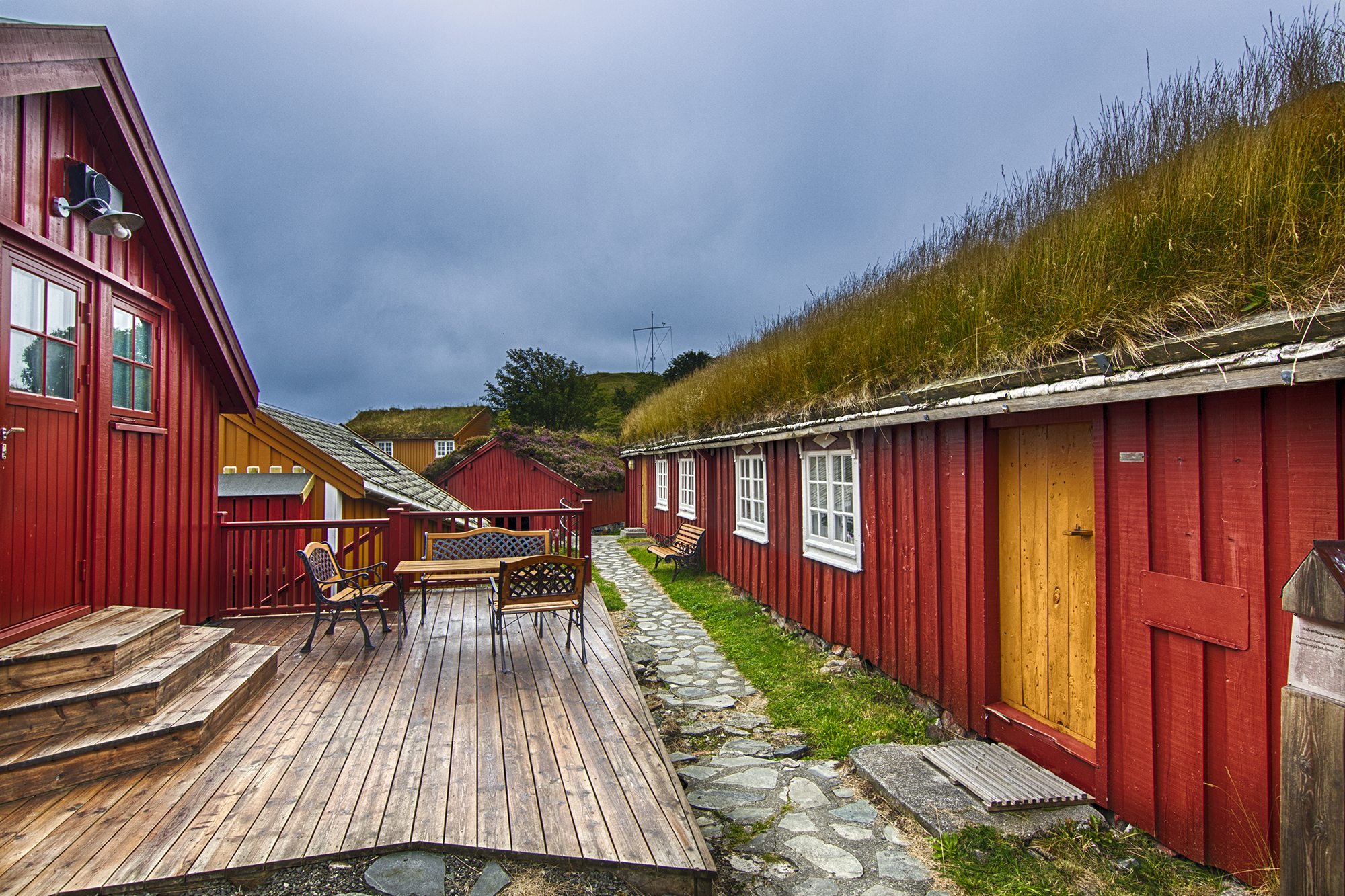 Red cabin exeteriors with grass on roof