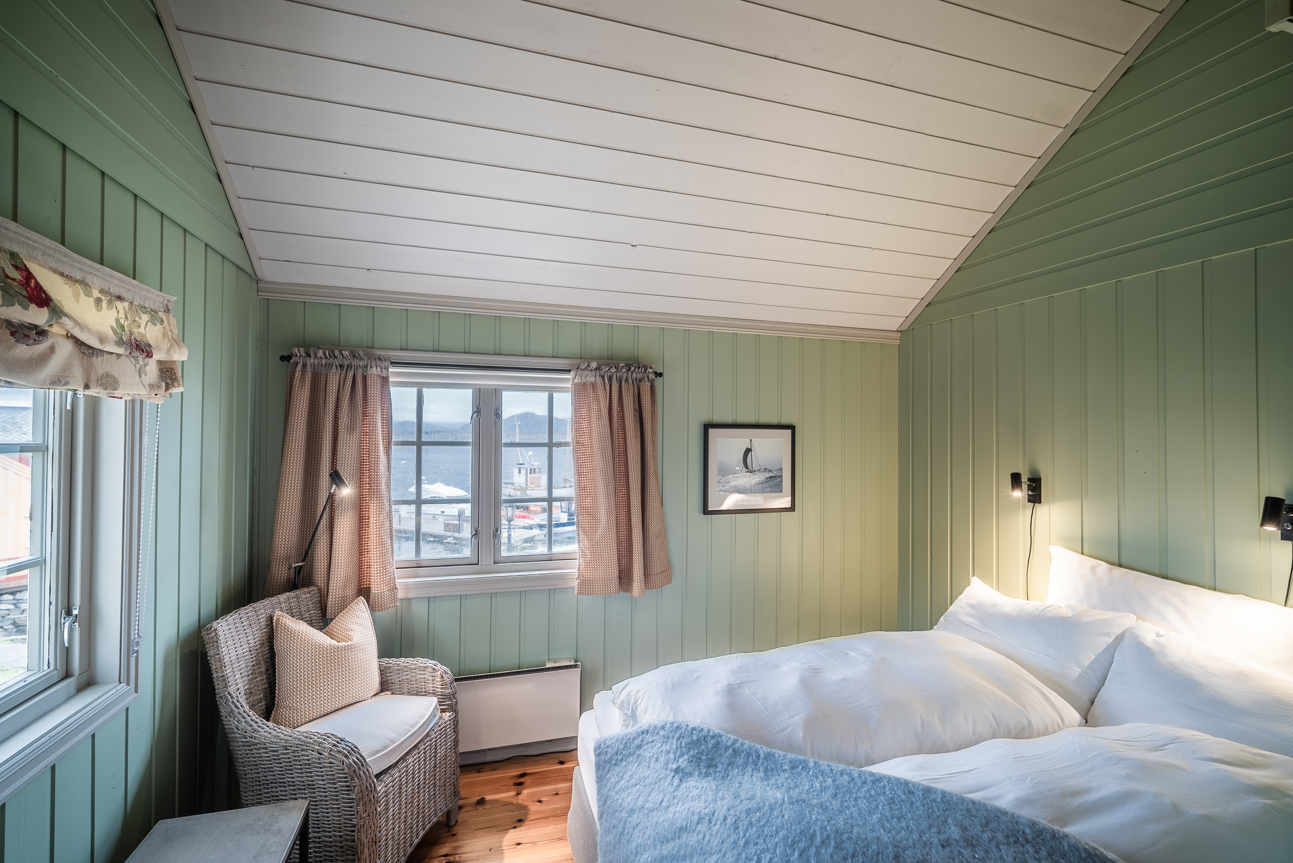 Green and white and blue room with wood