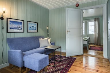 Wooden floors and blue wooden walls of suite