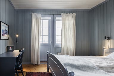 Veranda room blue wood and long curtains