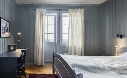 Veranda room blue wood and long curtains