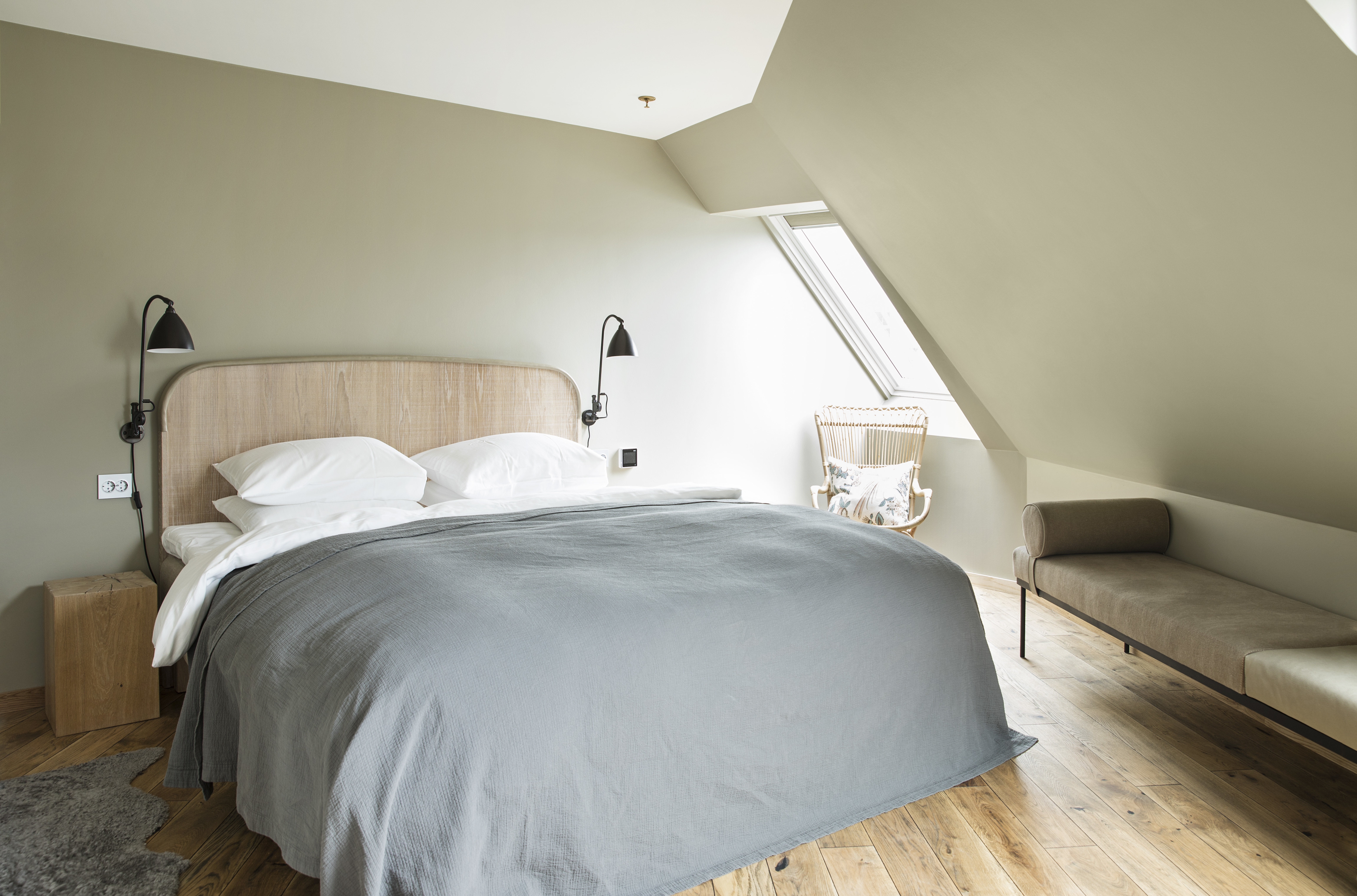 Hotel Brosundet Alesund bedroom in eaves with grey covers and wooden floor