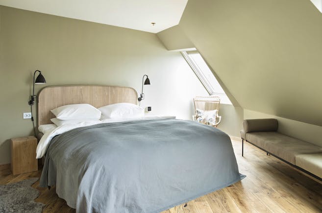 Hotel Brosundet Alesund bedroom in eaves with grey covers and wooden floor