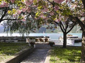 Hotel Ullensvang Norway garden by water with blossom on tree