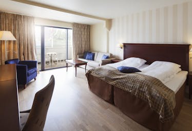 Hotel Ullensvang Norway brown and beige junior suite with balcony