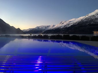 Hotel Ullensvang Norway outdoor pool in winter with snow on mountains