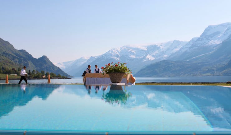 Hotel Ullensvang Norway view of pool, fjord waters and mountains