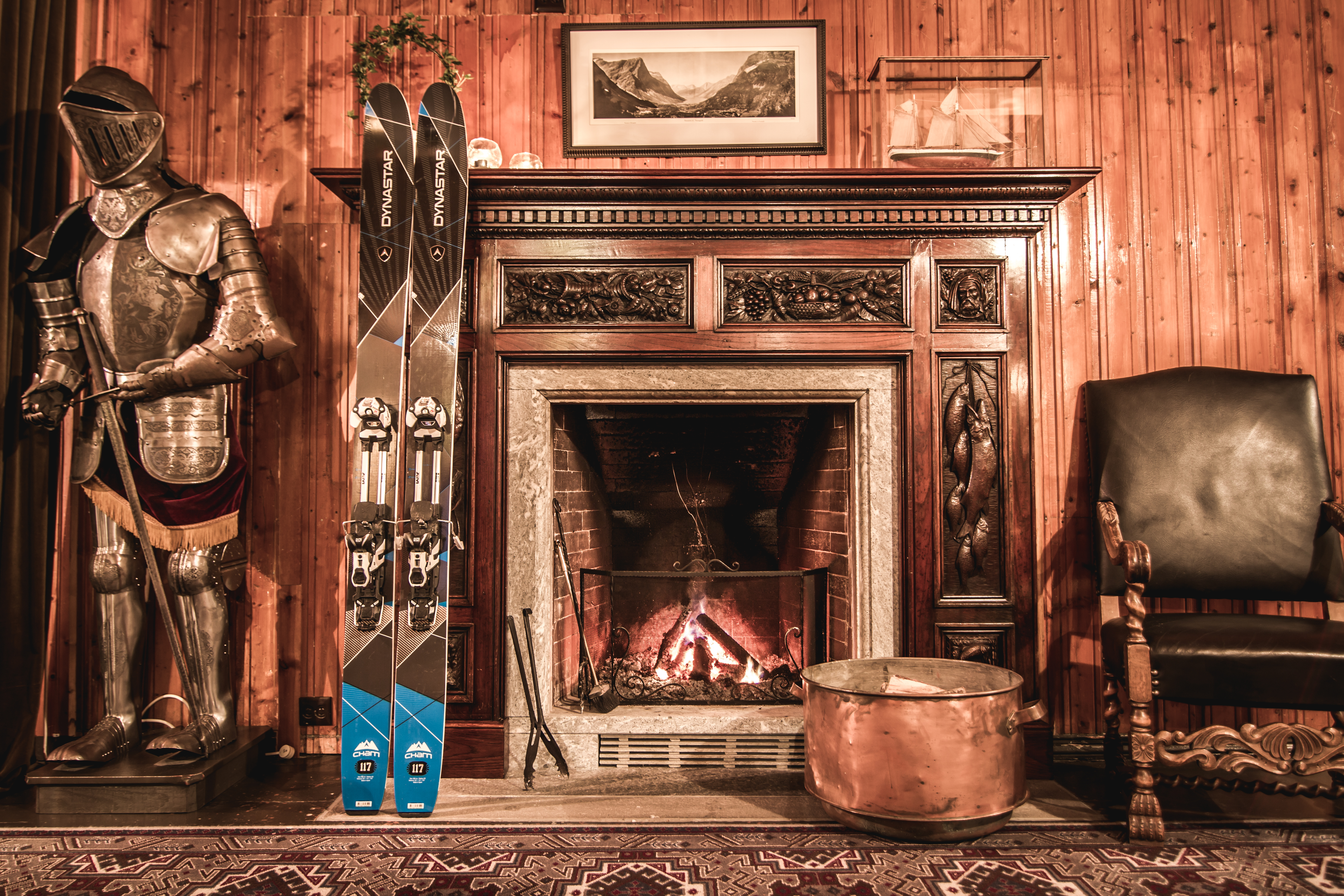 hotel union oye norway fireplace with skis and suit of armour