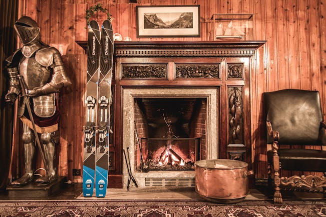 hotel union oye norway fireplace with skis and suit of armour