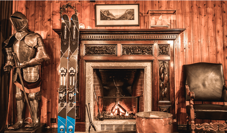 hotel union oye norway fireplace with skis and suit of armour
