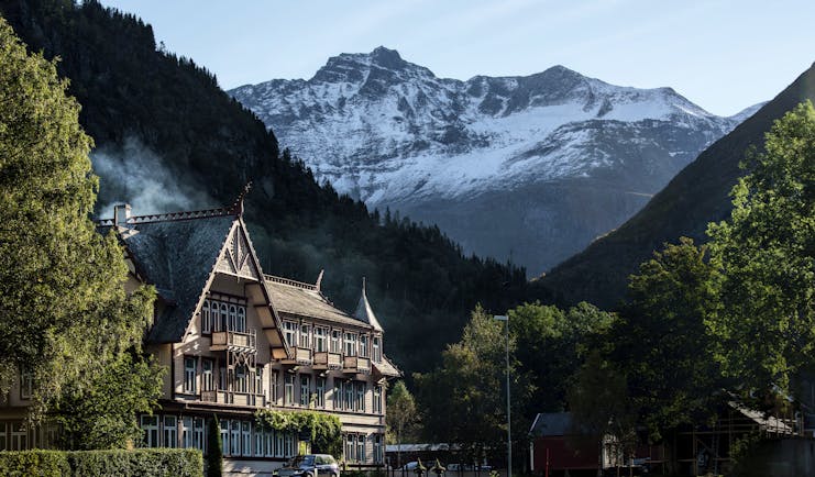 hotel union oye norway tall house with steep roof and grass and mountain