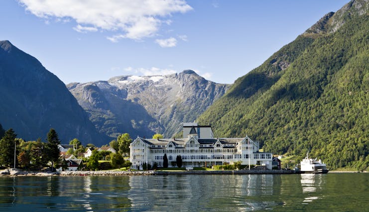 Exterior of white hotel building on fjord side at Kviknes hotel