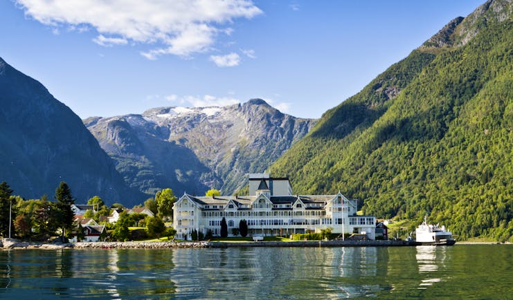 Exterior of white hotel building on fjord side at Kviknes hotel
