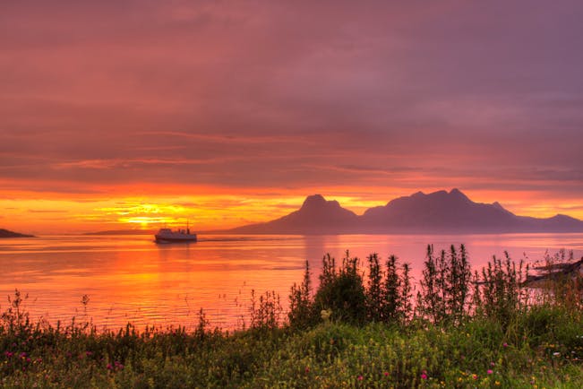 Sunset with water and boat Bodo