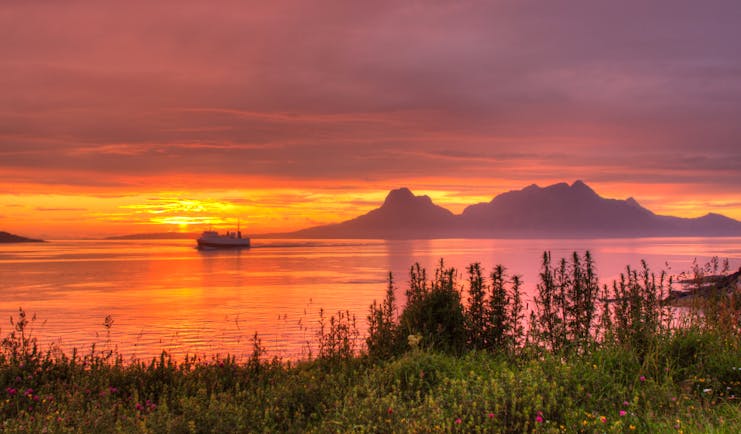 Sunset with water and boat Bodo