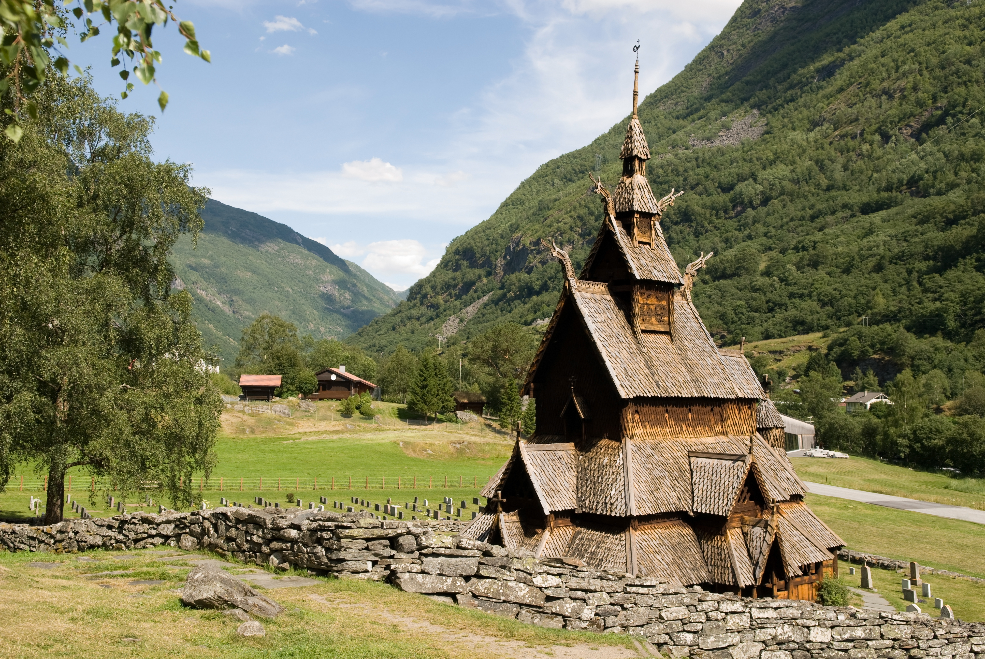 Wooden stave church in field at Borgund