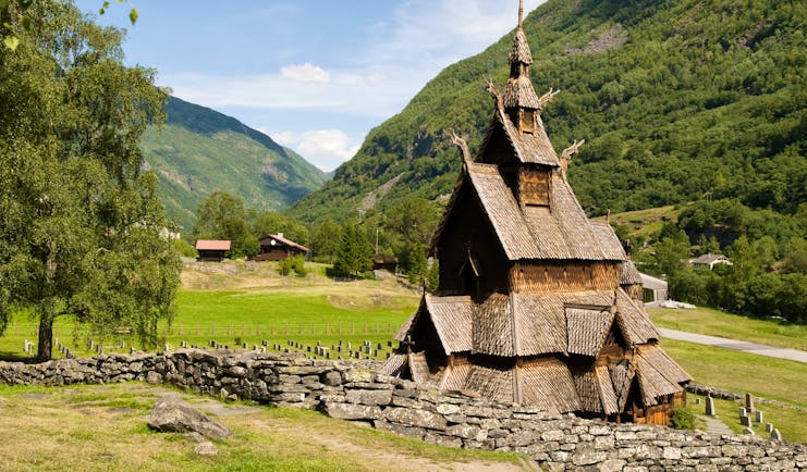 Wooden stave church in field at Borgund