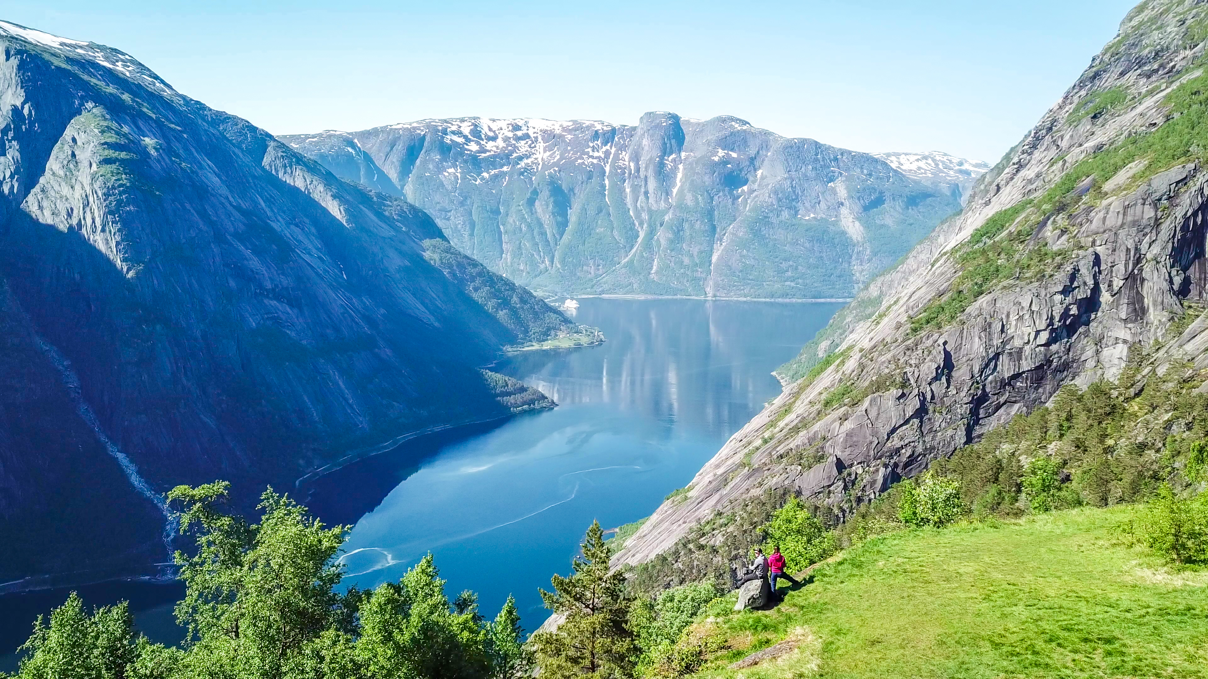 Fjord with blue water and grey mountains Eidfjord