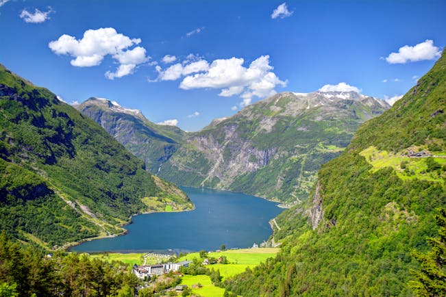 Geirangerfjord with pastures, mountains and tree-clad slopes