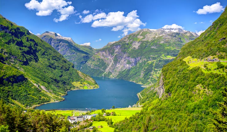 Geirangerfjord with pastures, mountains and tree-clad slopes