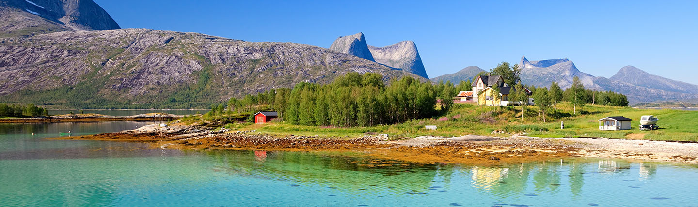 Efjorden Norway mountains, house and bright green blue water
