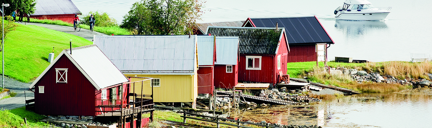 Coloured cabins on waterfront Tondelag