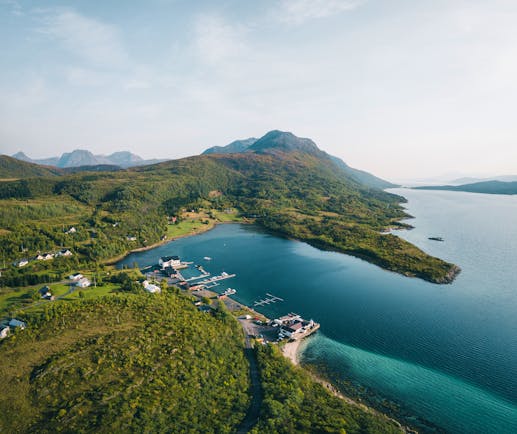 Senja Fjordhotell view from above in summer of hotel on water's edge