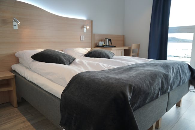 Senja Fjordhotell double room with grey and white bedding