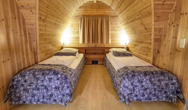 Snowhotel Kirkenes twin beds in wooden cabin