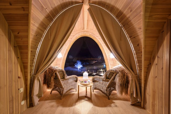 Snowhotel Kirkenes inside wooden cabin with big window