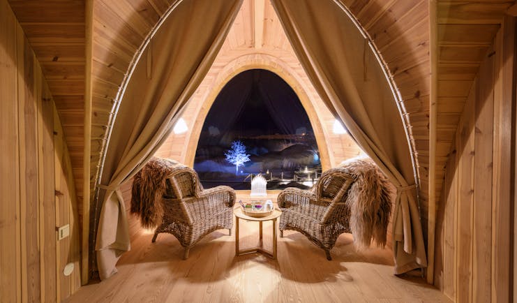 Snowhotel Kirkenes inside wooden cabin with big window