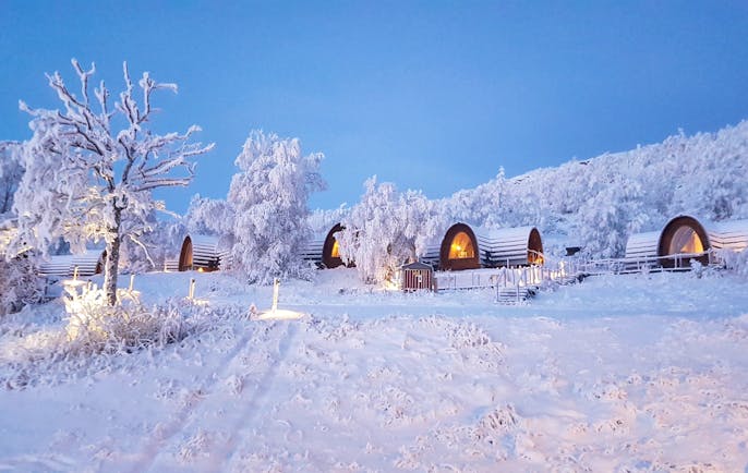 Snowhotel Kirkenes wooden cabins in the snow