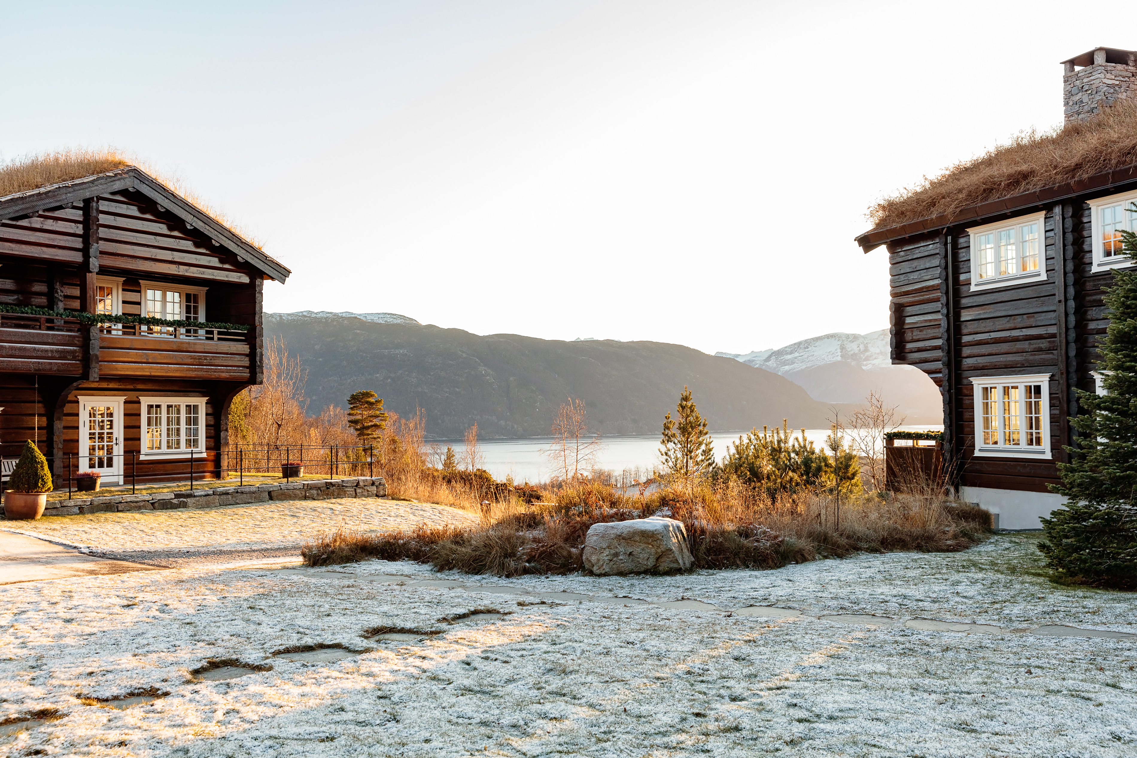 Storfjord Hotel wooden chalet dark wood and lake