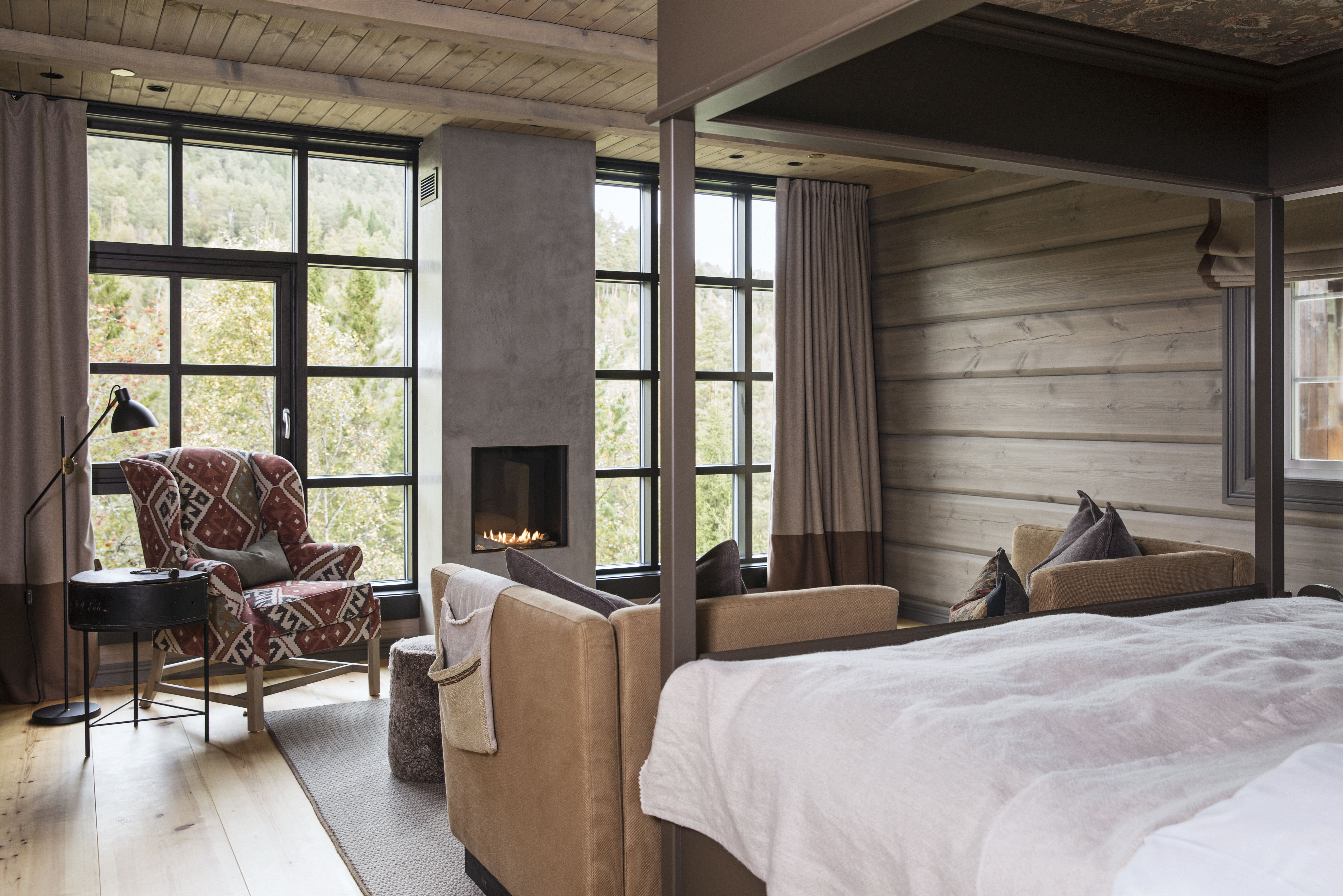 Storfjord Hotel room with white sheets and red chair