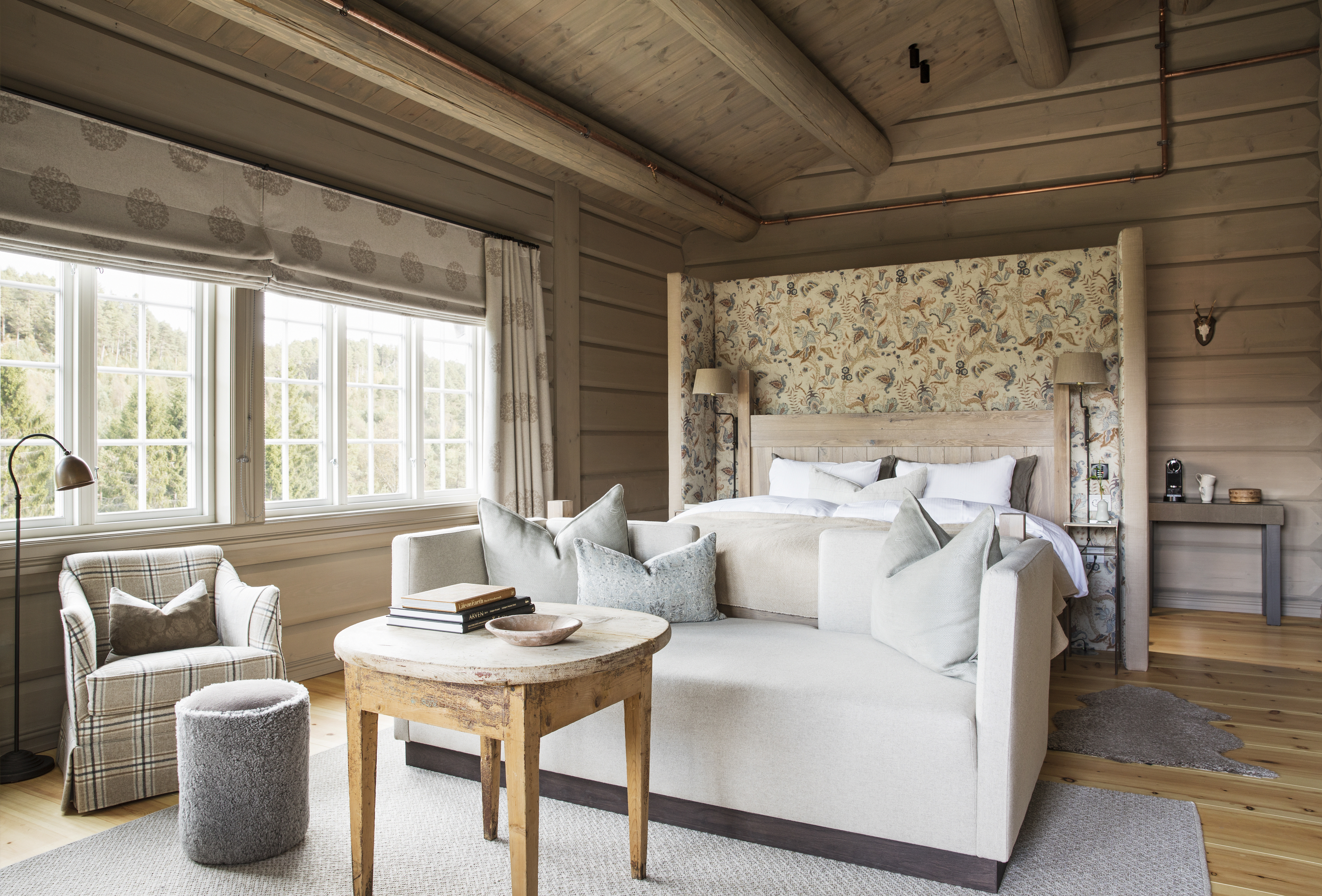 Storfjord Hotel room with white bed and sofa