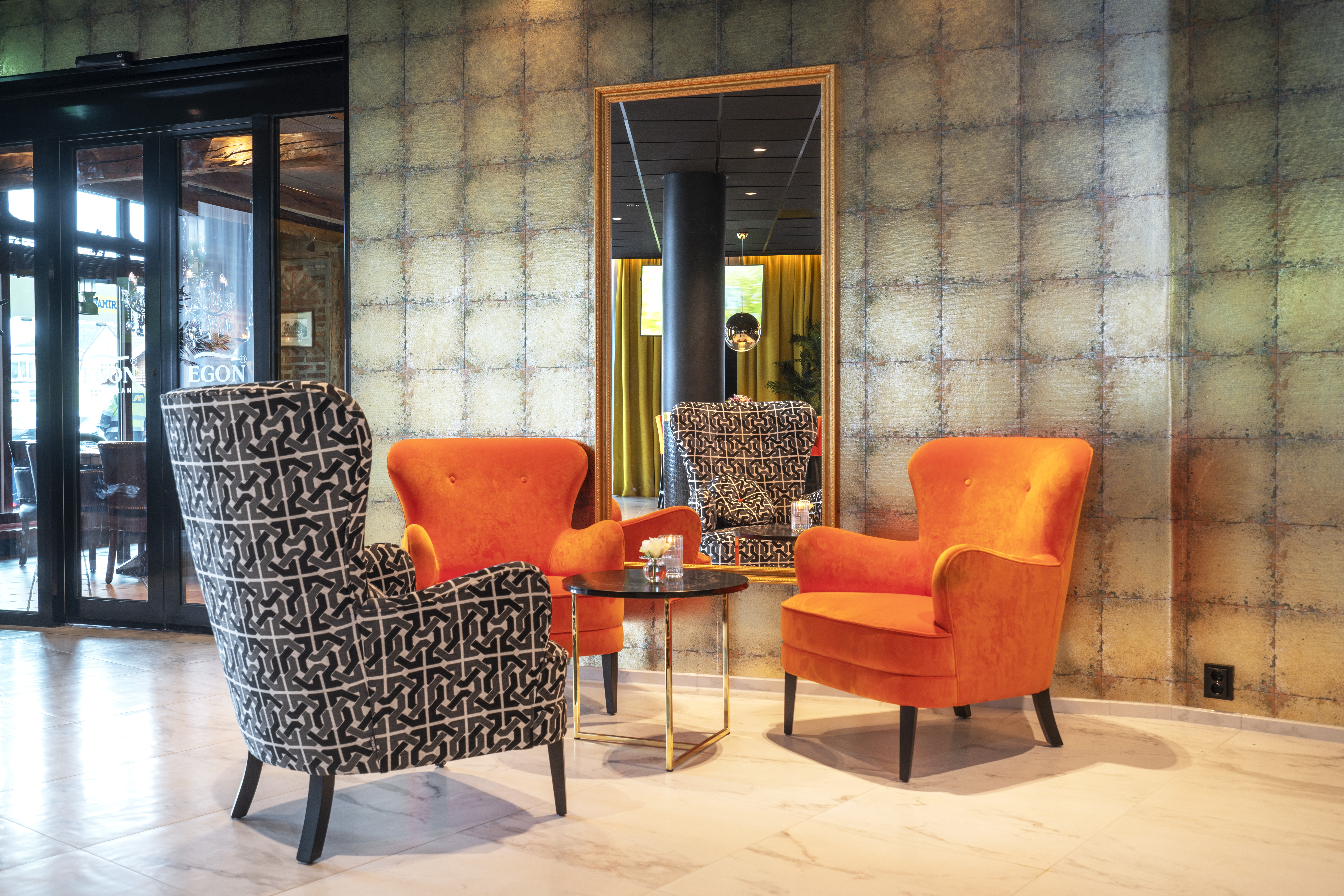 Thon Hotel Harstad lobby with orange and grey chairs