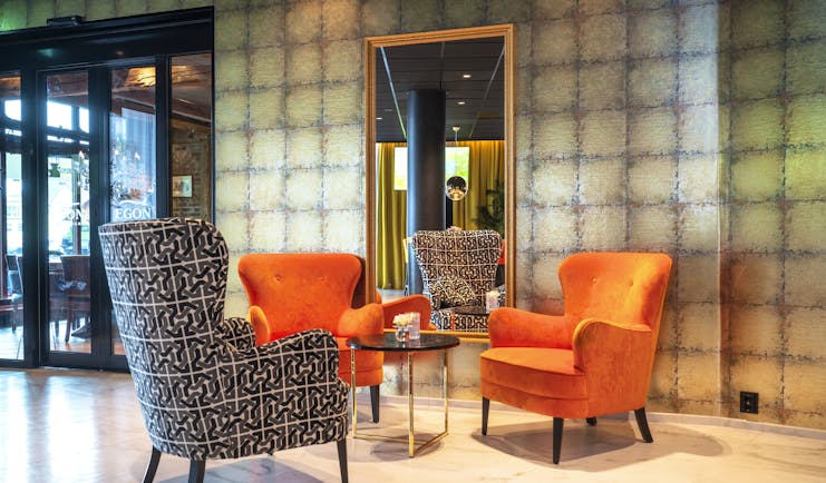 Thon Hotel Harstad lobby with orange and grey chairs