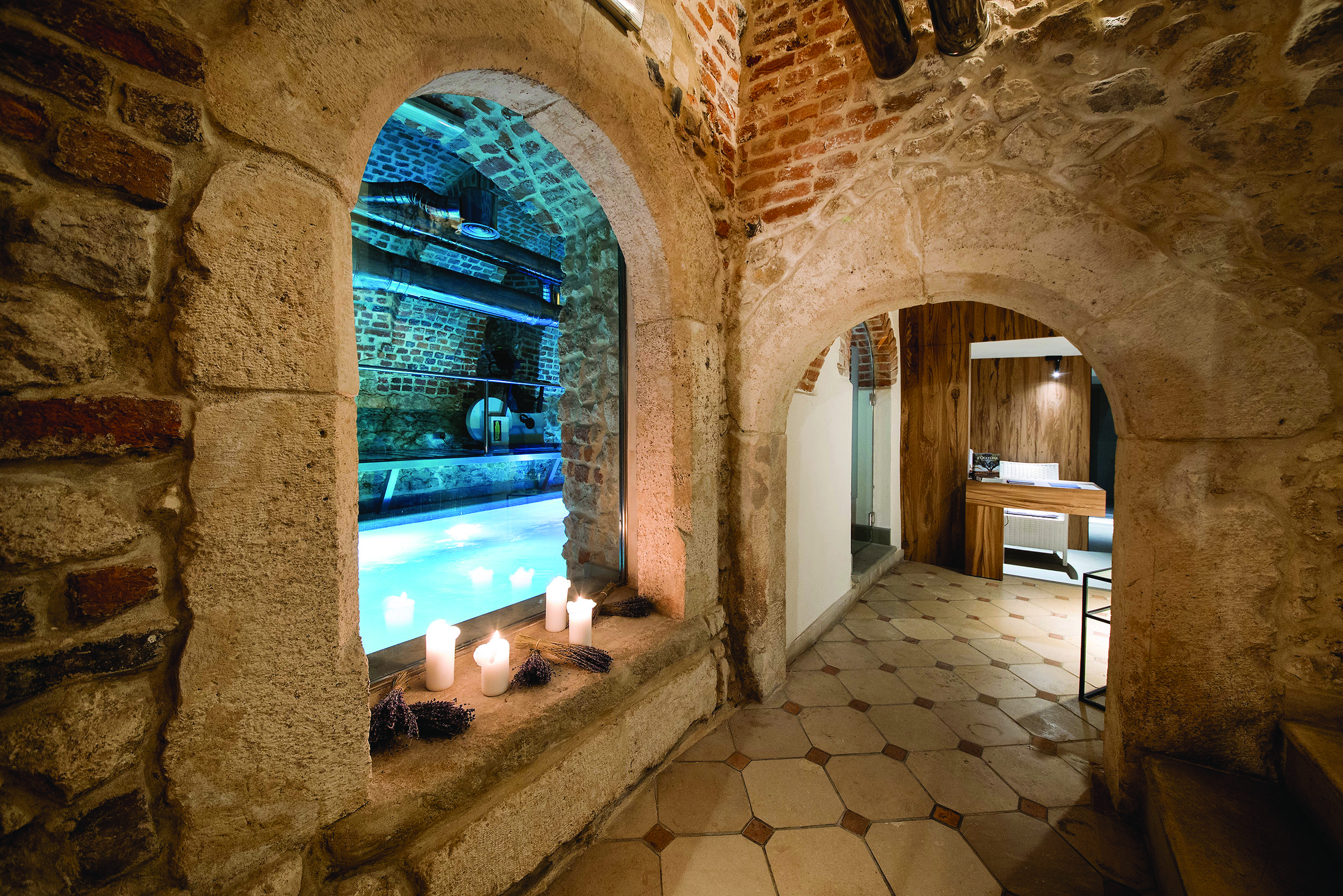 Hotel Copernicus Krakow indoor pool spa stone room with archways candles