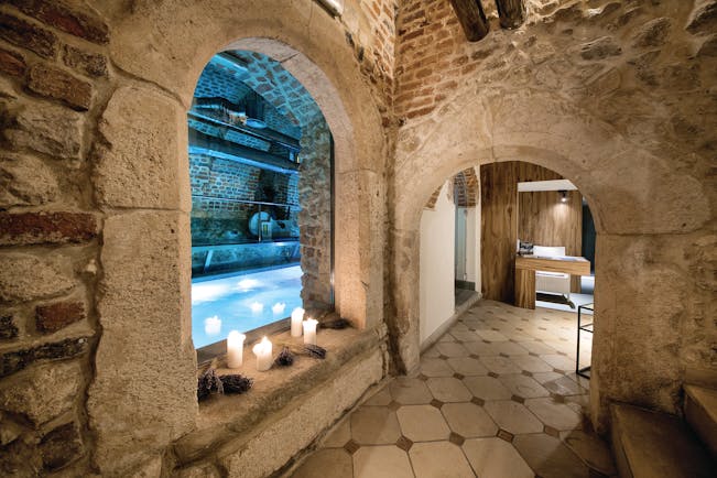 Hotel Copernicus Krakow indoor pool spa stone room with archways candles