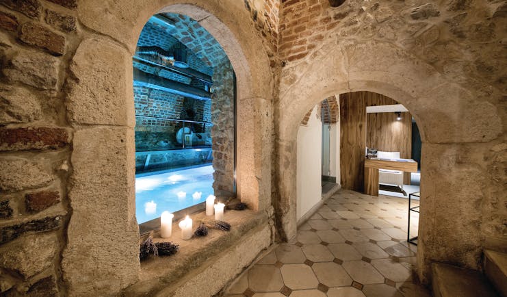 Hotel Copernicus Krakow indoor pool spa stone room with archways candles
