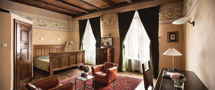 Hotel Copernicus Krakow luxury double bedroom wooden ceiling  leather chairs two large windows